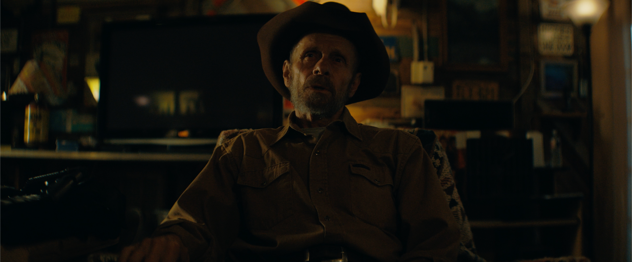 Bad River still: the sheriff seated in a dimly lit room